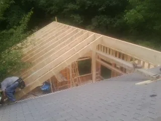 Framing a new roof addition that ties into an existing shingle roof in Hamburg